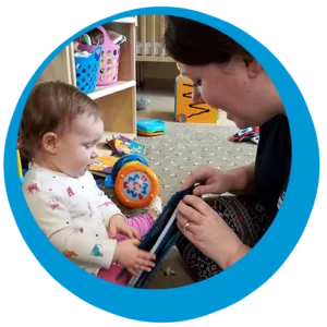 Teacher reading book to baby at school "Back to School" time is here!