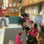 Representative Tobon reads to DDC Pawtucket Concord St. children