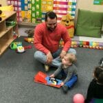 Representative Tobon reads to DDC Pawtucket Concord St. children