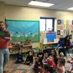 Representative Tobon reads to DDC Pawtucket Concord St. children